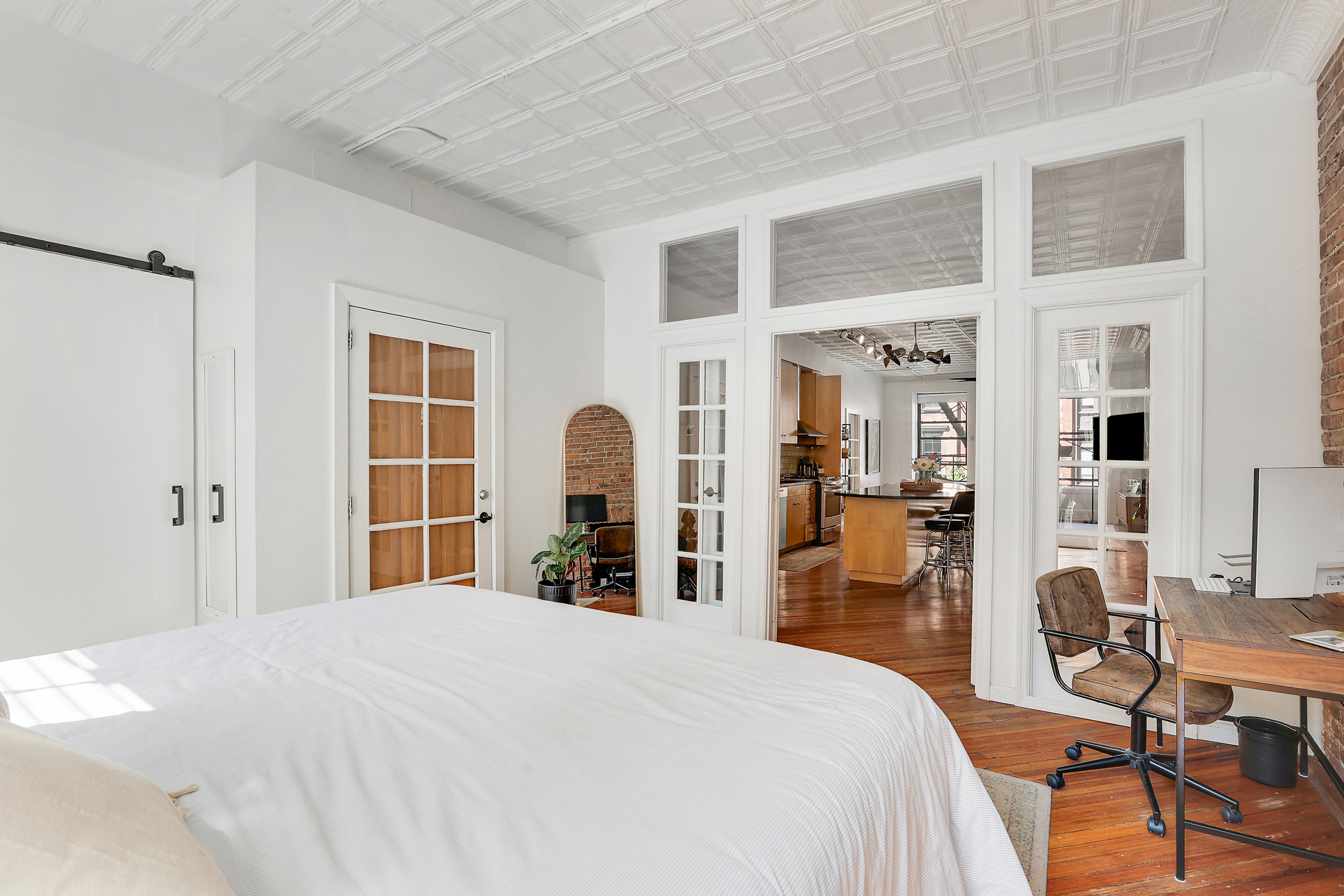 5 Great Jones Street Manhattan, NY 10012 - Photo 7 of 11 a bedroom with a bed and a table