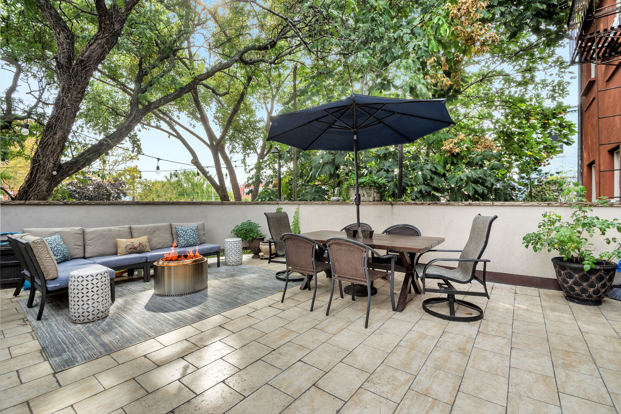10 Carroll Street Brooklyn, NY 11231 - Photo 17 of 28 a backyard of a house with table and chairs