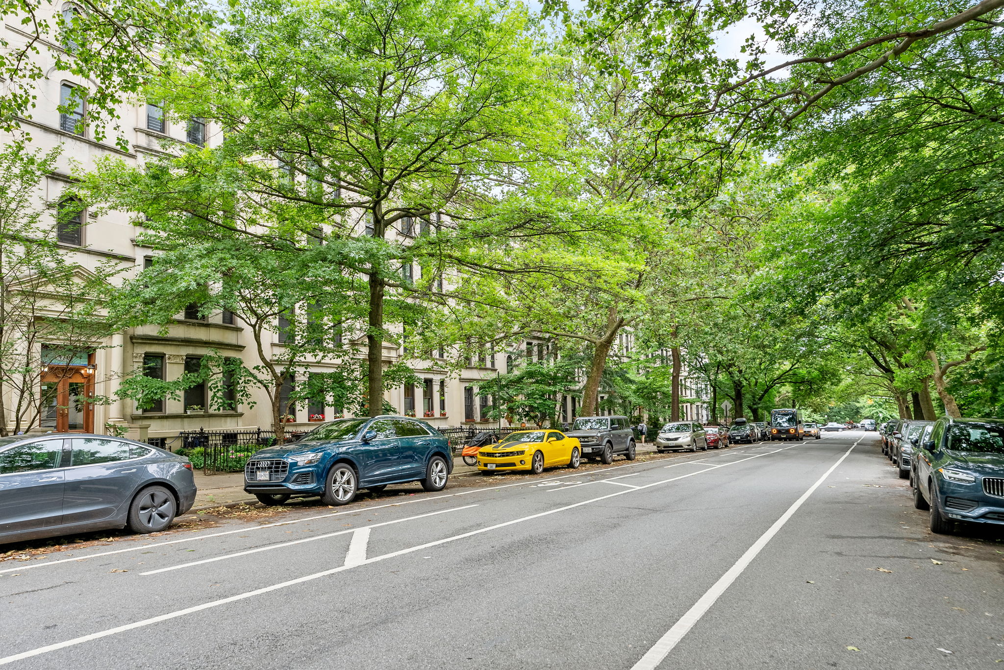 461 3rd Street, Unit 3L Brooklyn, NY 11215 - Photo 9 of 10 a view of road with card parked on side and retail shops