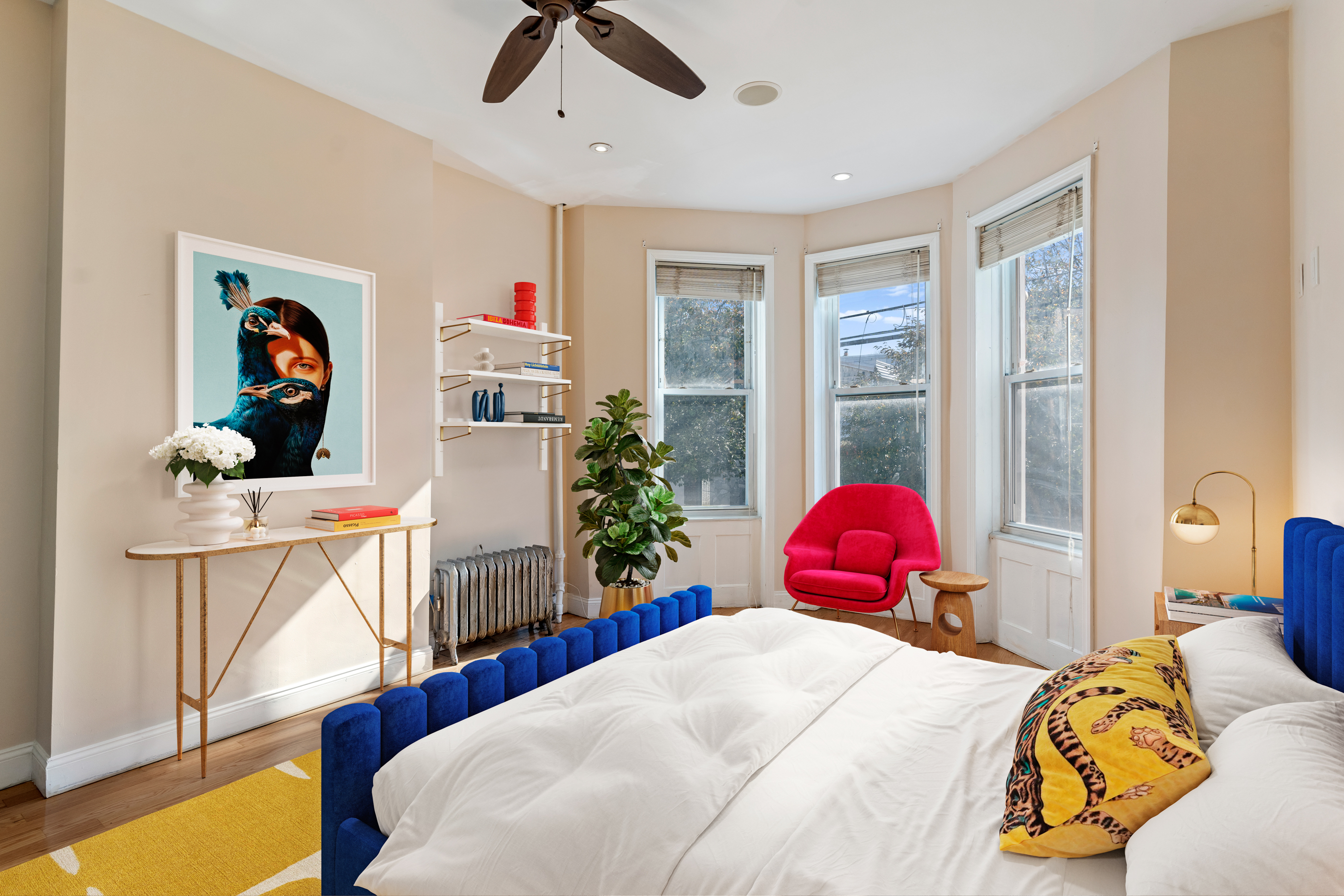 60-13 Menahan Street, Unit 1 Queens, NY 11385 - Photo 10 of 19 a bedroom with a bed a couch and a window