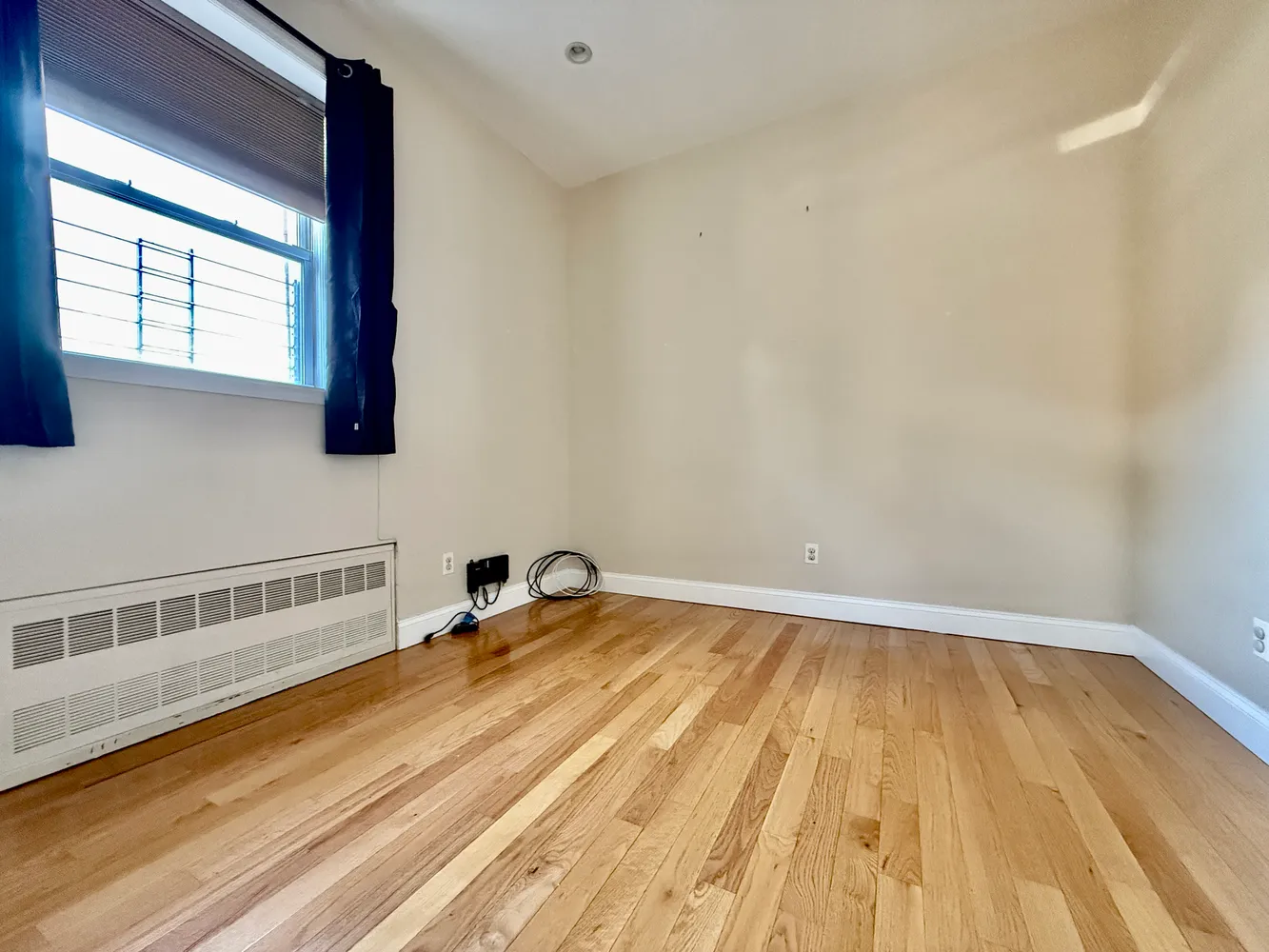 a view of a room with wooden floor and small space