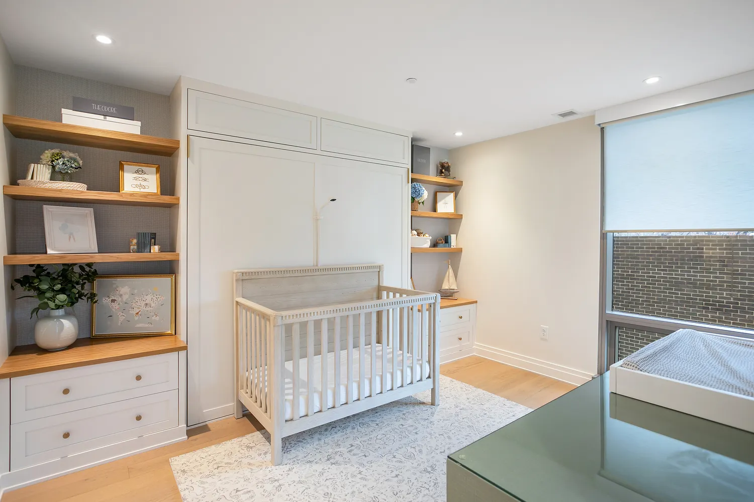 a spacious bedroom with a bed and a cabinets