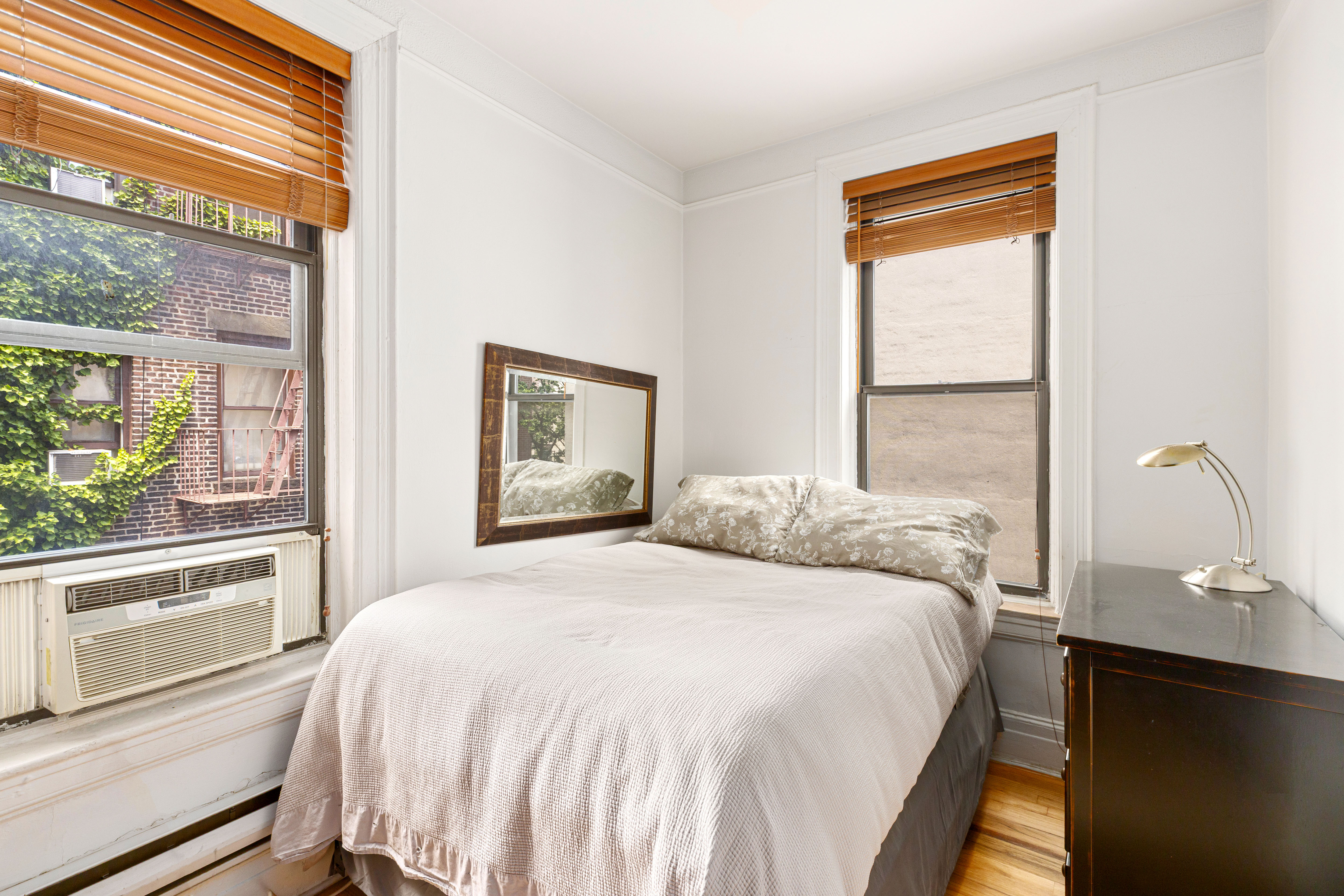 199 Prince Street, Unit 17 Manhattan, NY 10012 - Photo 3 of 6 a bedroom with a bed and a window