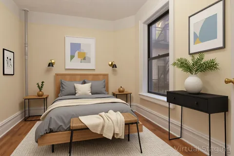 a bedroom with a bed and window