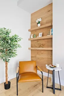a lamp on a table with a potted plant