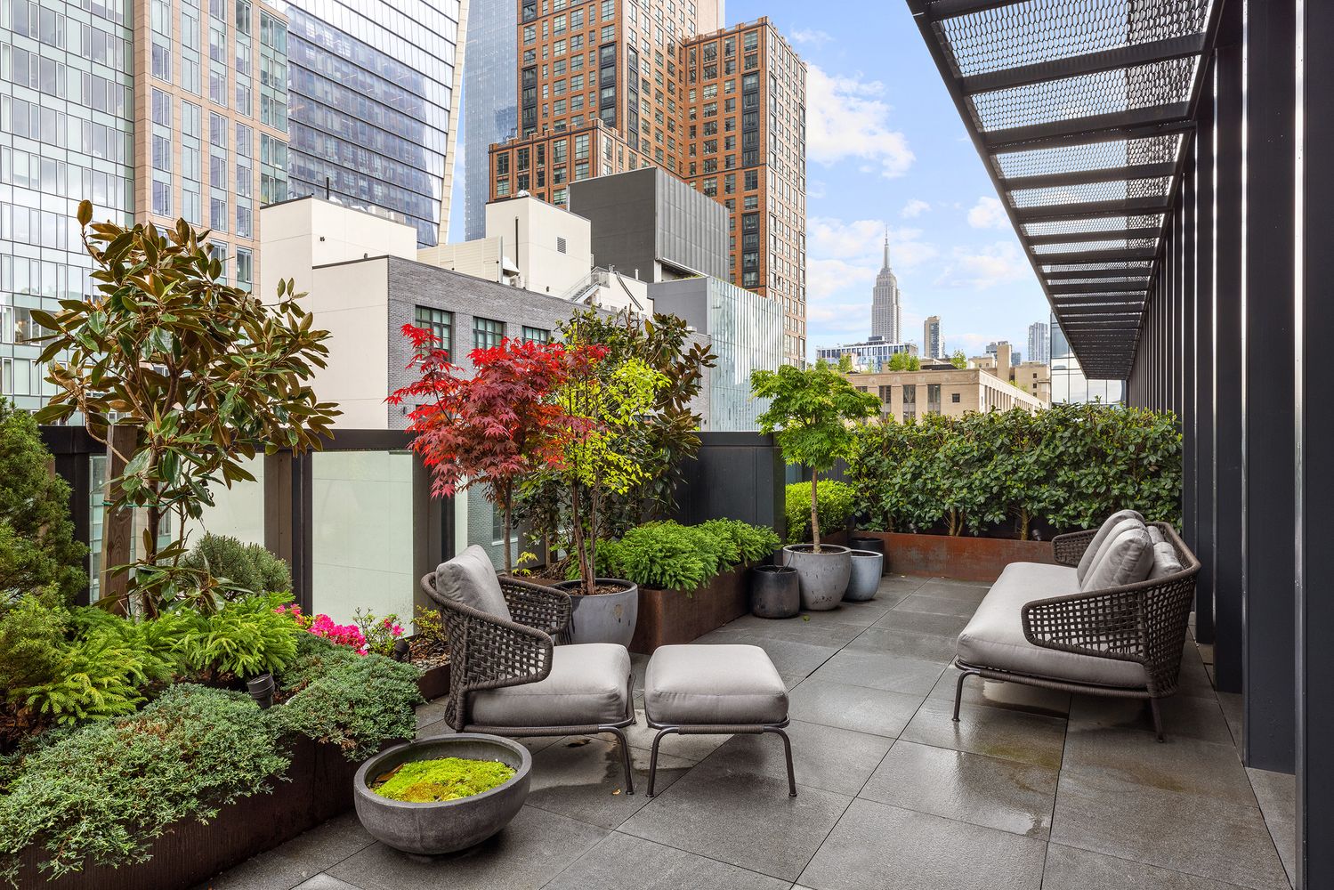 522 West 29th Street, Unit PH9C Manhattan, NY 10001 - Photo 1 of 16 a building outdoor space with patio furniture and potted plants