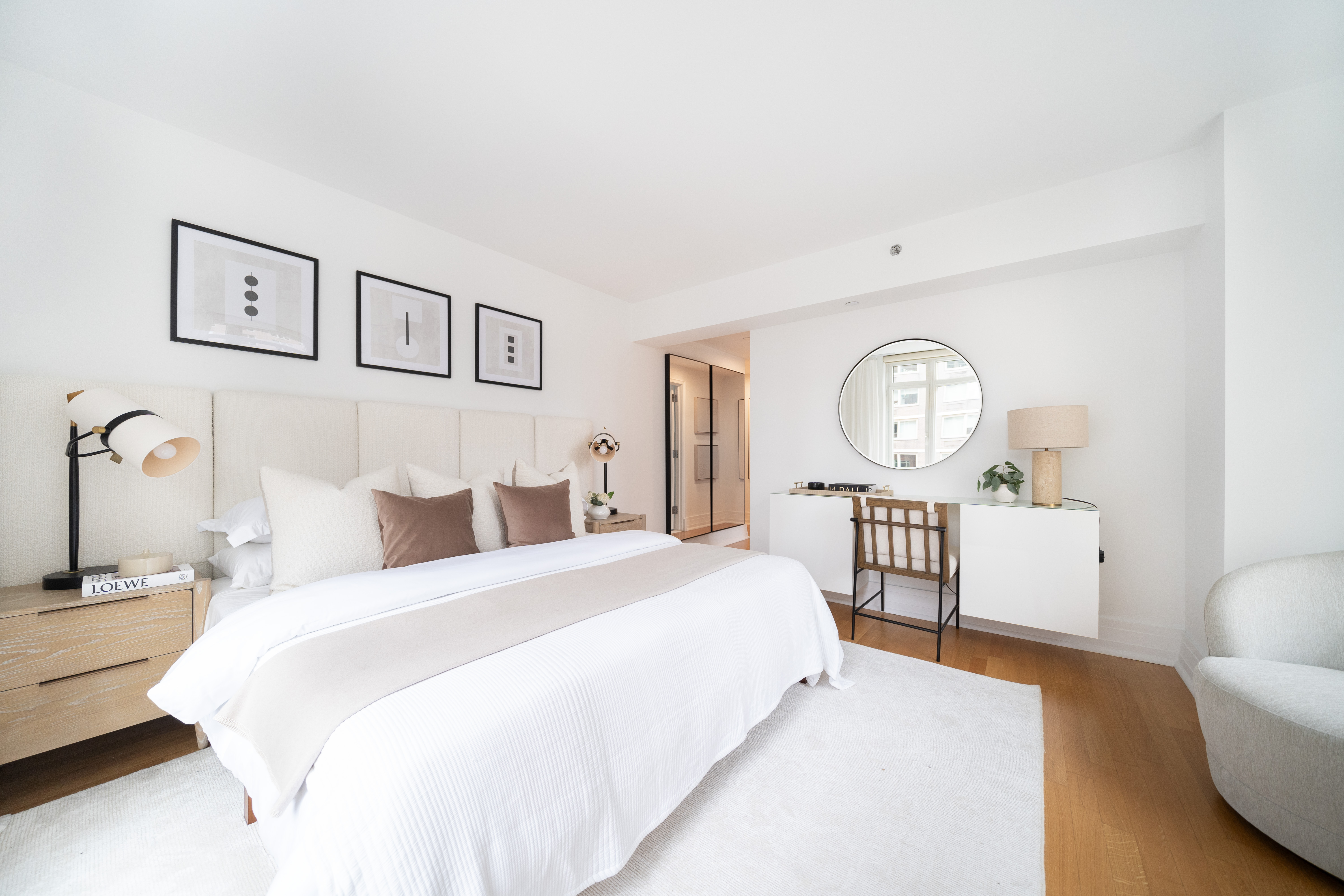 205 East 85th Street, Unit G10 Manhattan, NY 10028 - Photo 9 of 27 a bedroom with a bed a mirror and a window