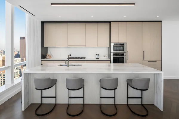 a kitchen with stainless steel appliances a sink and a counter space