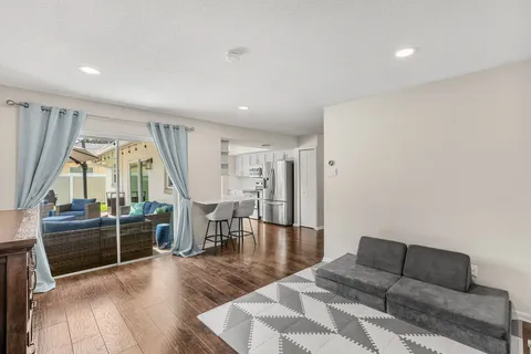 a bedroom with furniture and a rug