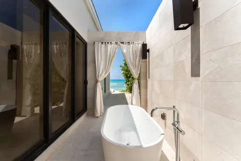 a bathroom with a tub and shower