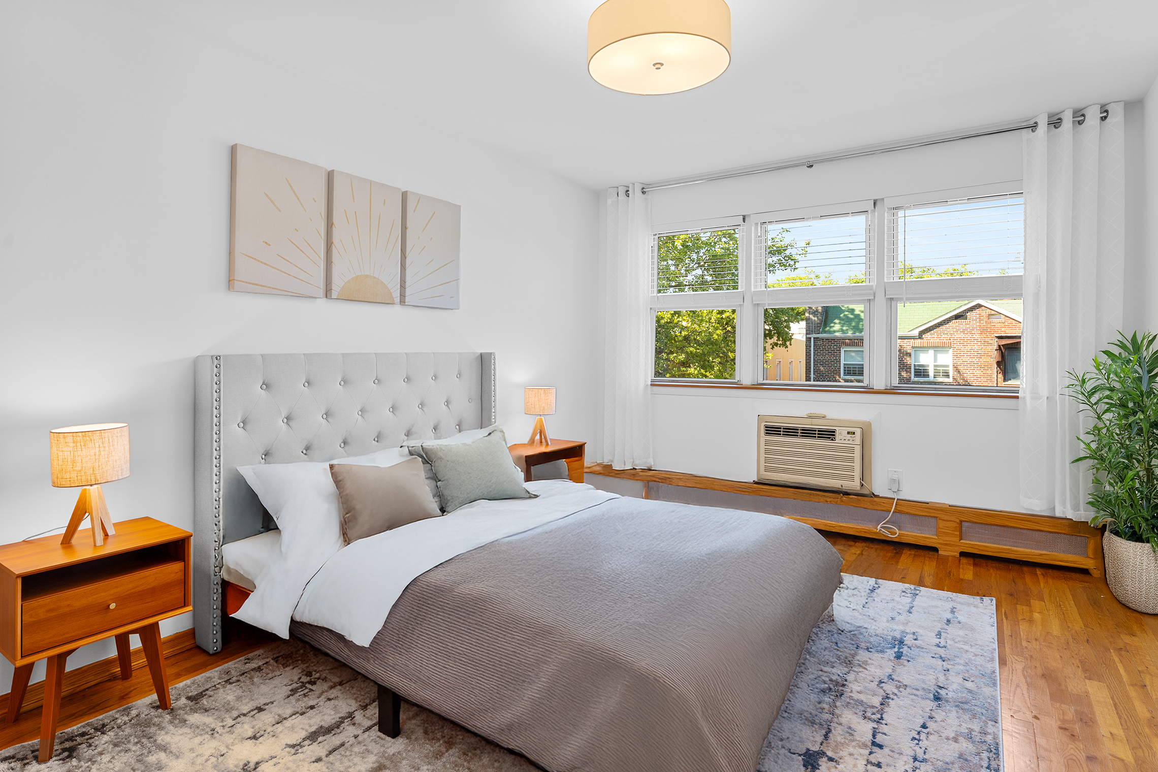 336 99th Street, Unit 15 Brooklyn, NY 11209 - Photo 4 of 7 a bedroom with a bed and wooden floor