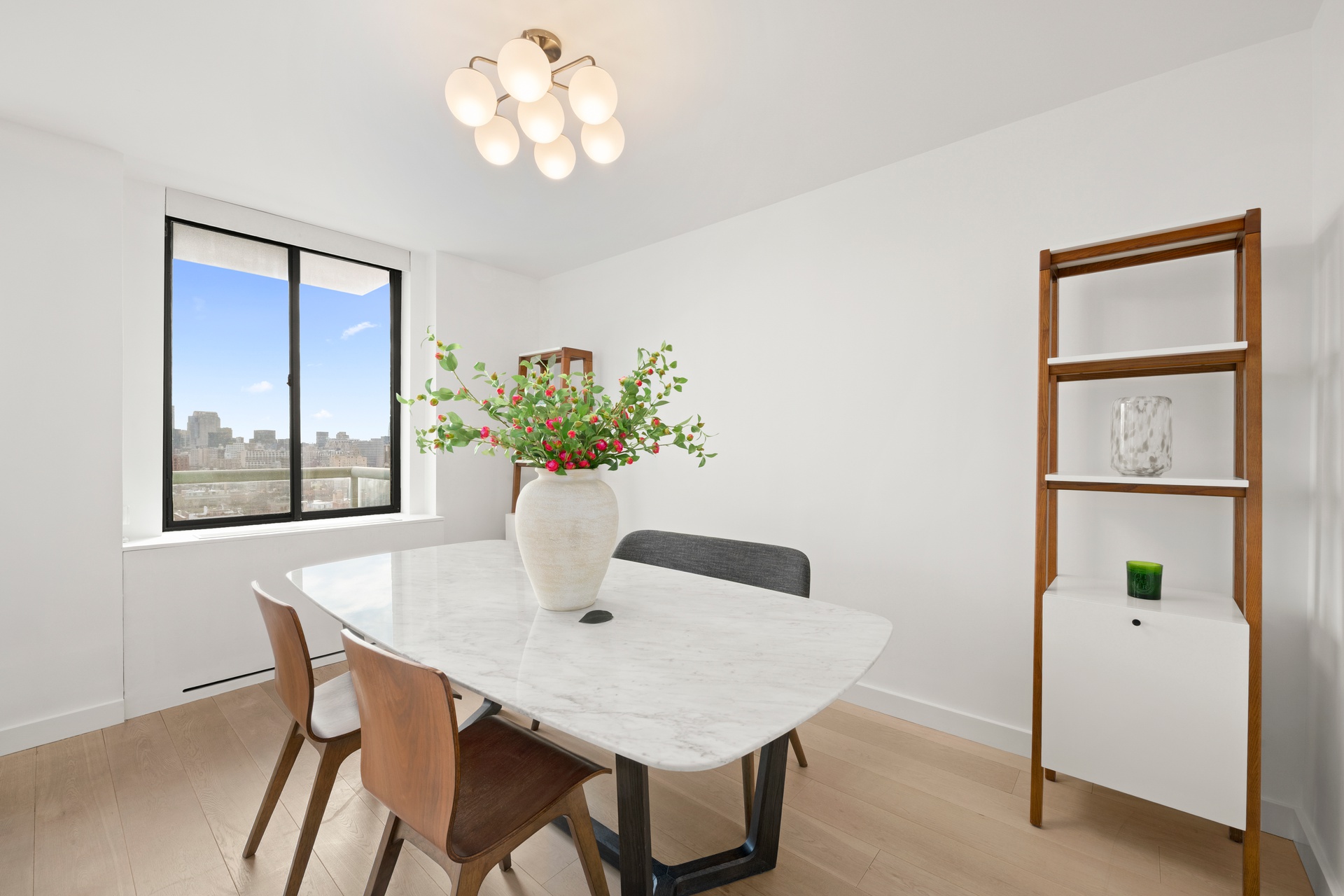 22 West 15th Street, Unit 19D Manhattan, NY 10011 - Photo 7 of 18 a dining room with furniture and window