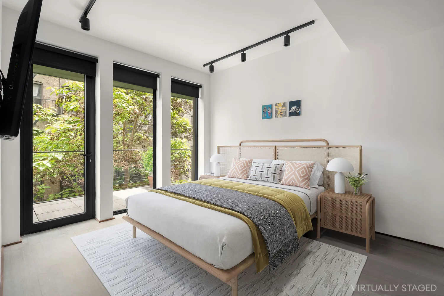 a bedroom with a large bed and a large window