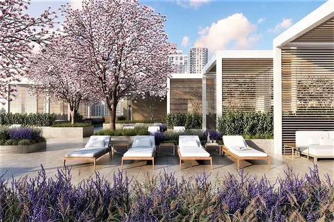 a view of a patio with couches table and chairs and wooden fence