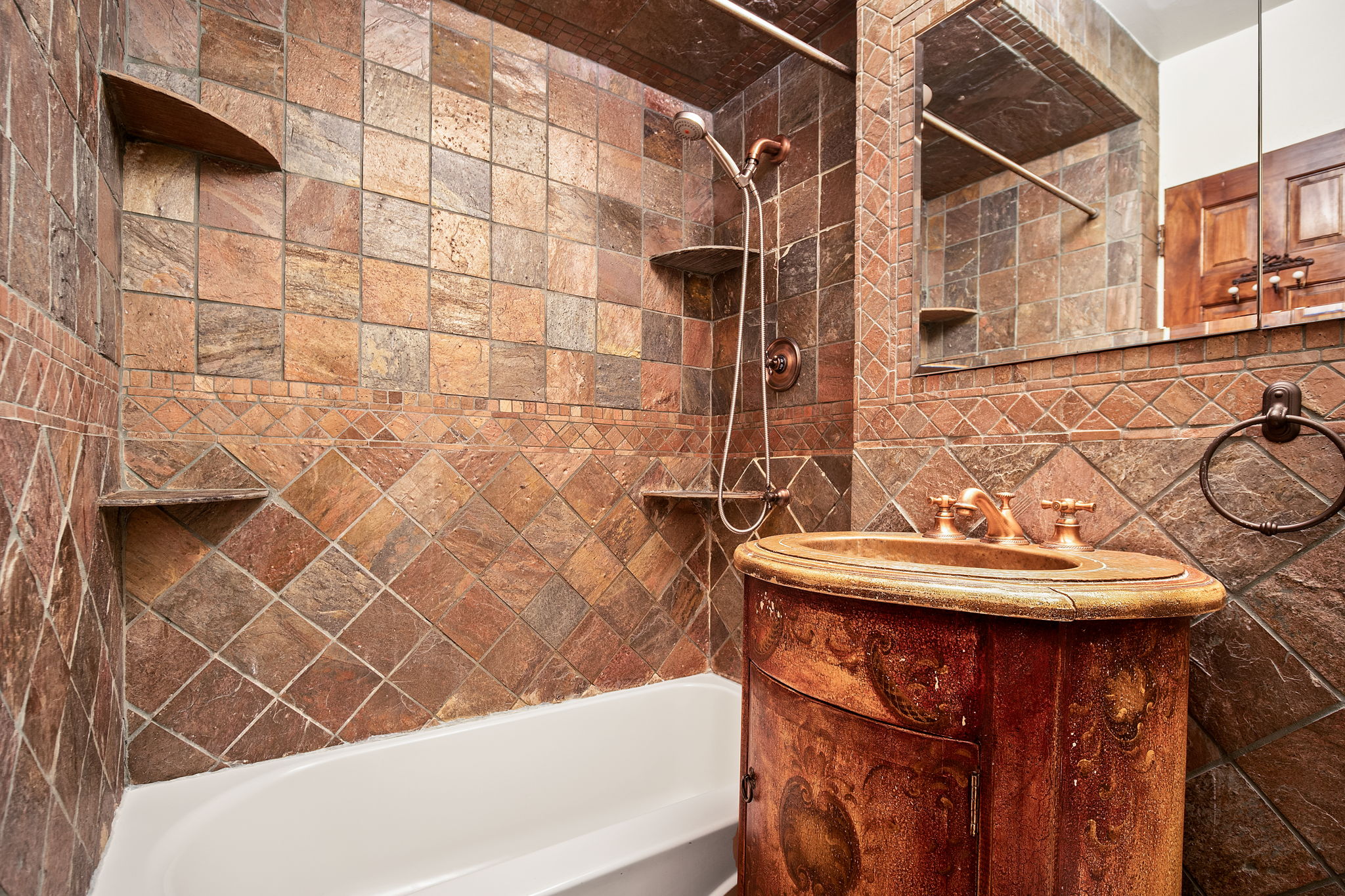 155 East 38th Street, Unit 5L Manhattan, NY 10016 - Photo 7 of 9 a bathroom with a sink and a bathtub