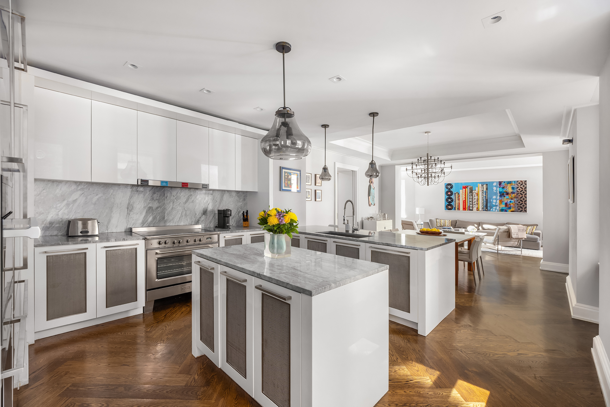 344 West 72nd Street, Unit 1007 Manhattan, NY 10023 - Photo 3 of 23 a kitchen with a stove cabinets and wooden floor