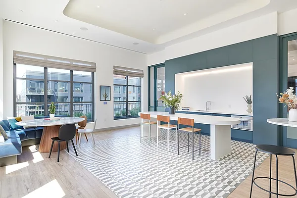 160 Front Street, Unit 517 Brooklyn, NY 11201 - Photo 10 of 14 a view of a dining room with furniture wooden floor and a potted plant