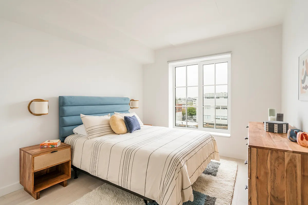 350 Clarkson Avenue, Unit 307 Brooklyn, NY 11226 - Photo 2 of 5 a bedroom with a bed and a window