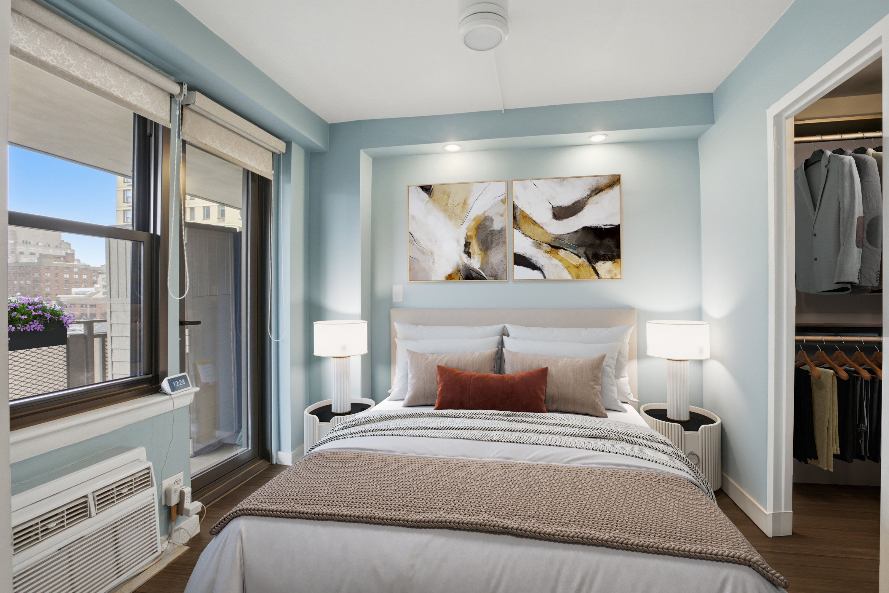 345 East 81st Street, Unit 9D Manhattan, NY 10028 - Photo 5 of 17 a bedroom with a large bed and a chandelier