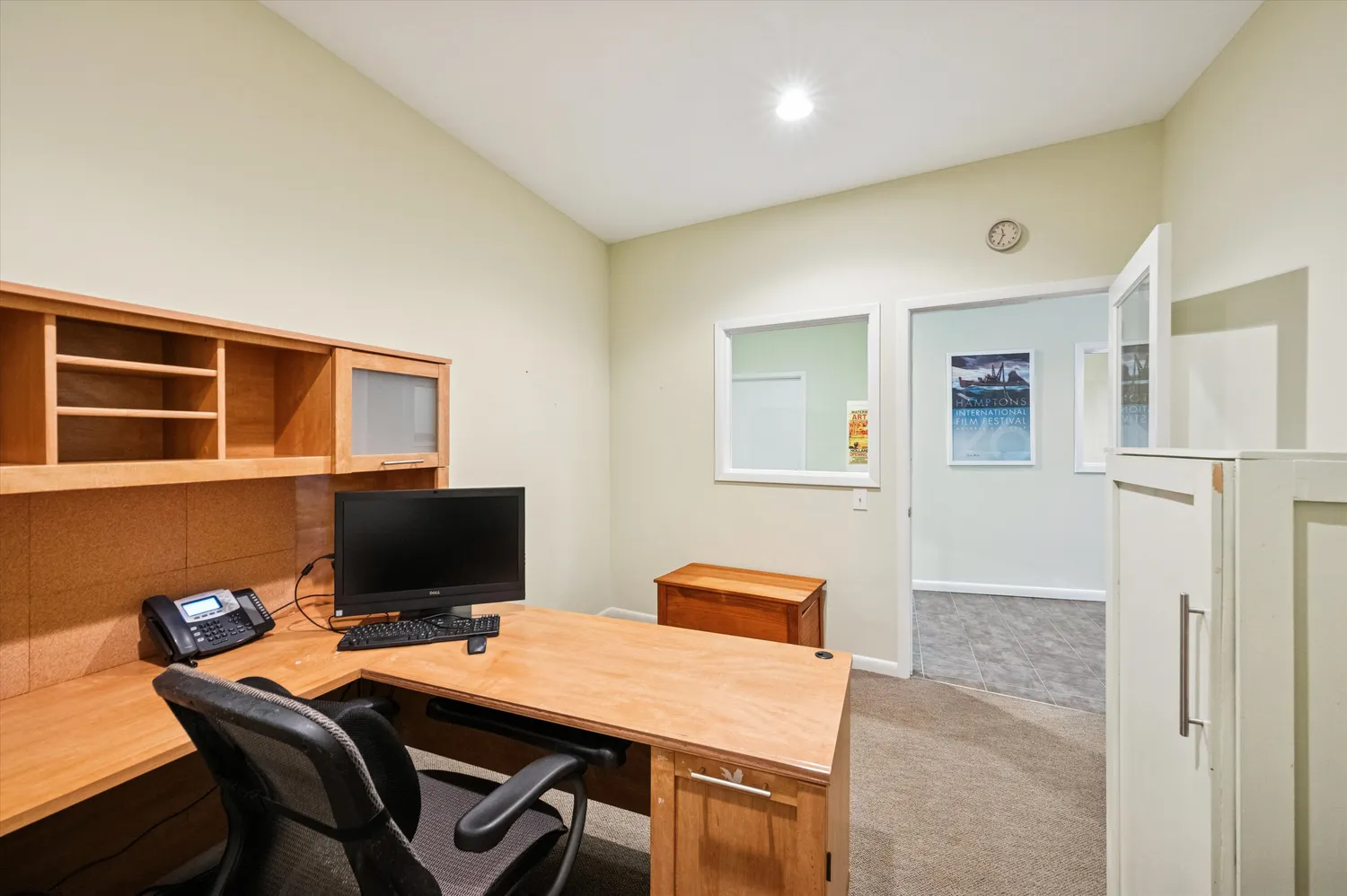 a view of hallway with stairs and furniture