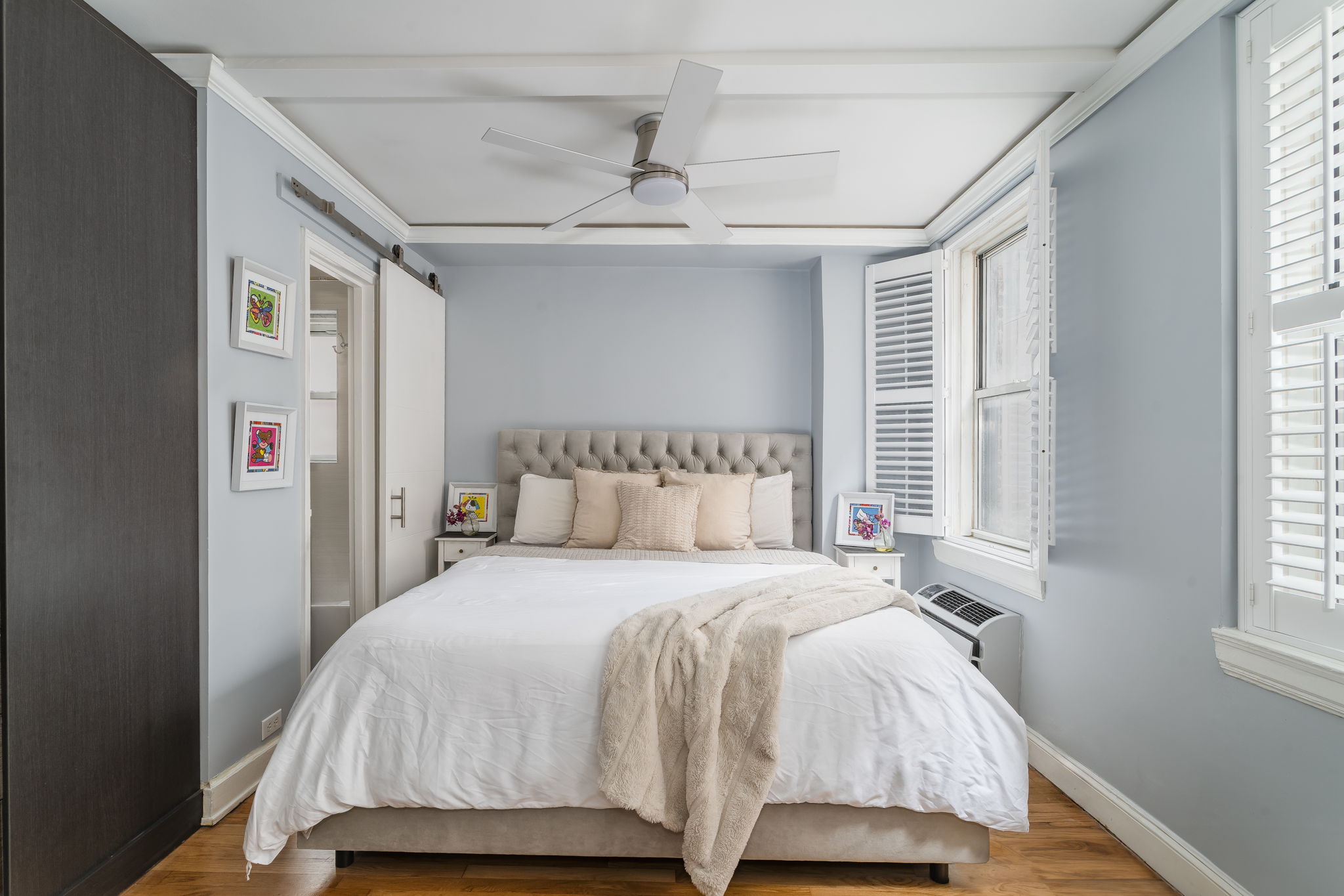 155 East 49th Street, Unit 10E Manhattan, NY 10017 - Photo 4 of 12 a bedroom with a bed and a window