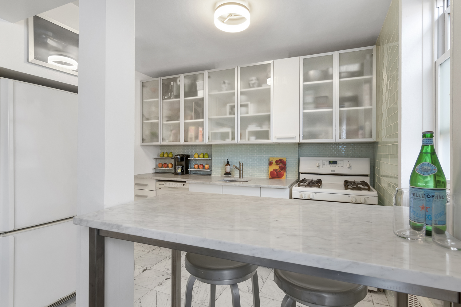 35-50 75th Street, Unit 5G Queens, NY 11372 - Photo 4 of 8 a kitchen with a table and chairs