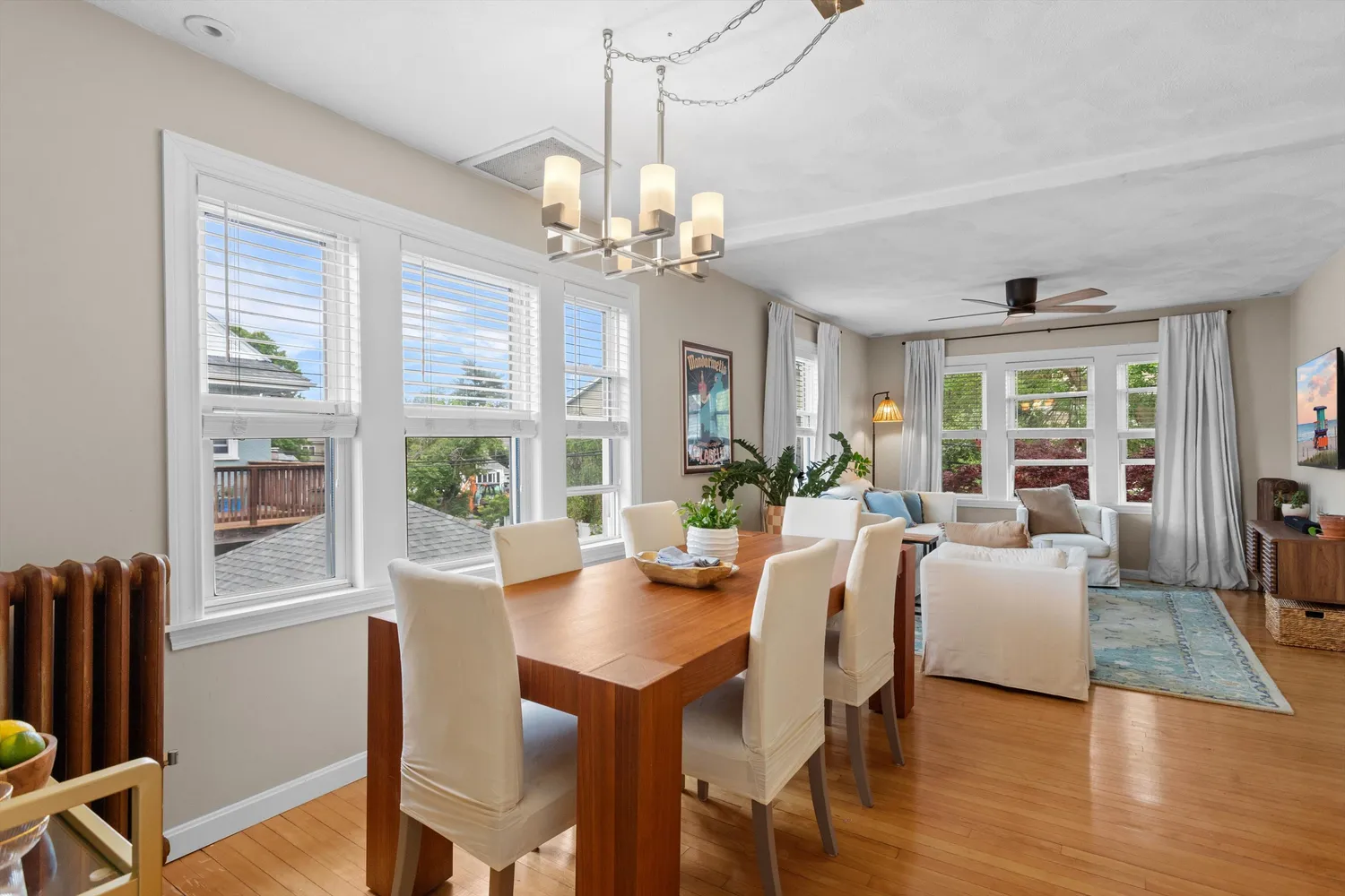 a kitchen with stainless steel appliances granite countertop a refrigerator a sink a stove and white cabinets