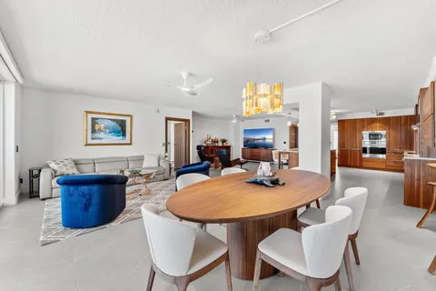 a large kitchen with a table and chairs