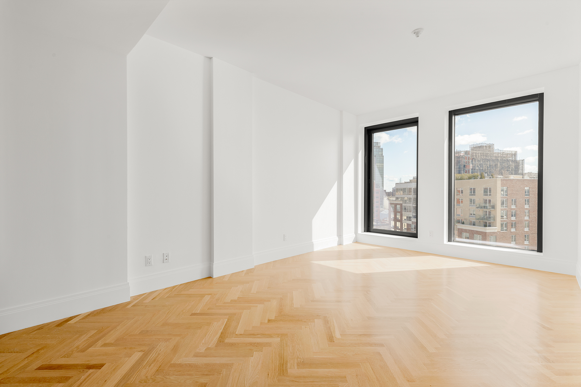 300 West 122nd Street, Unit 12C Manhattan, NY 10027 - Photo 4 of 11 a view of an empty room with a window
