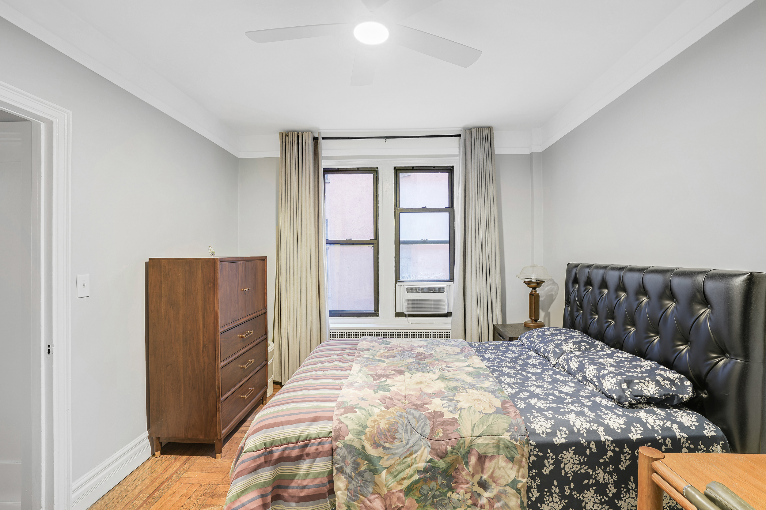 129 West 89th Street, Unit 36 Manhattan, NY 10024 - Photo 12 of 14 a bedroom with a bed and a window