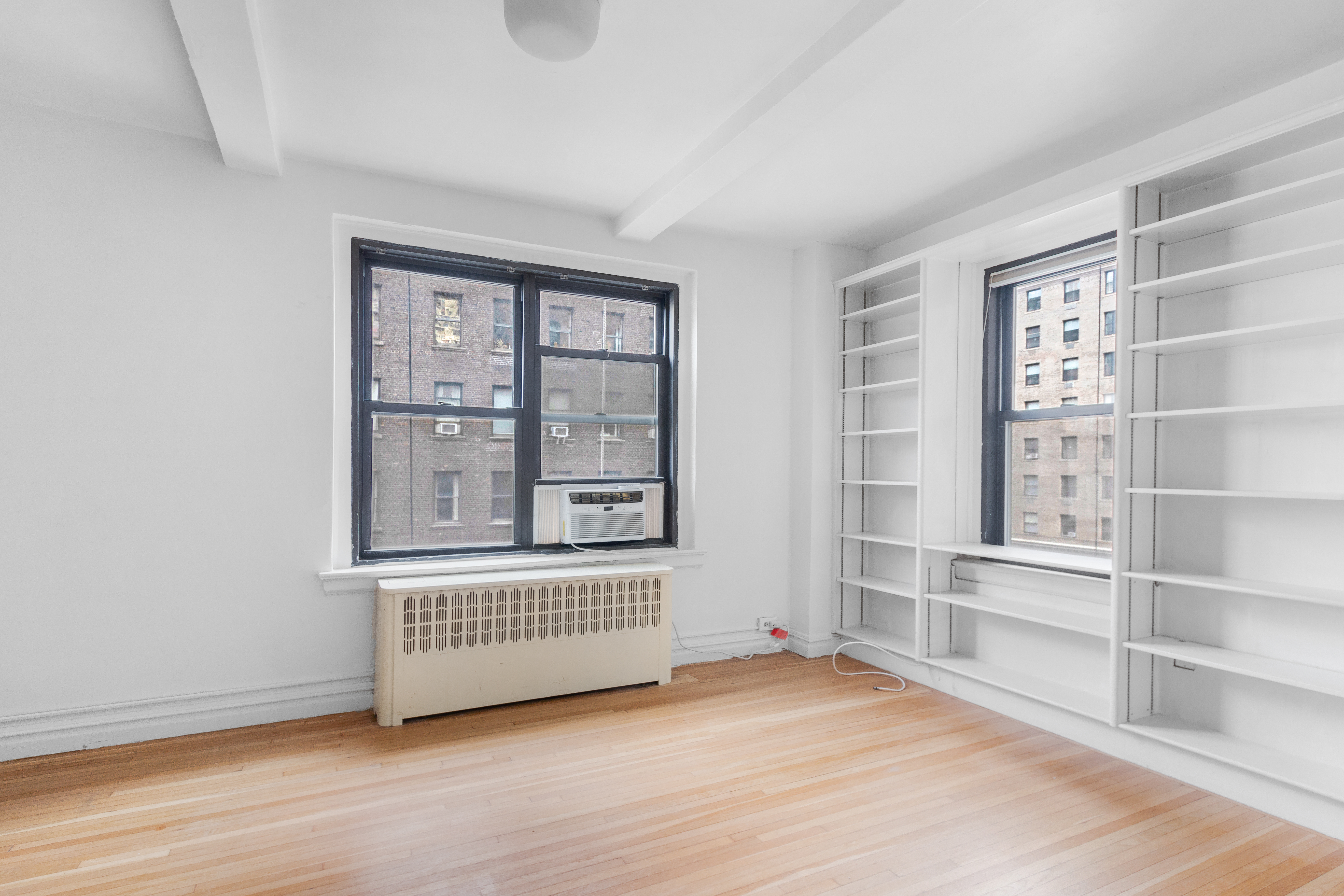 235 West End Avenue, Unit 8G Manhattan, NY 10023 - Photo 11 of 13 a view of an empty room with a window