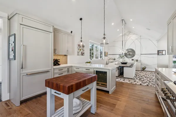 a kitchen with a stove a sink and a microwave