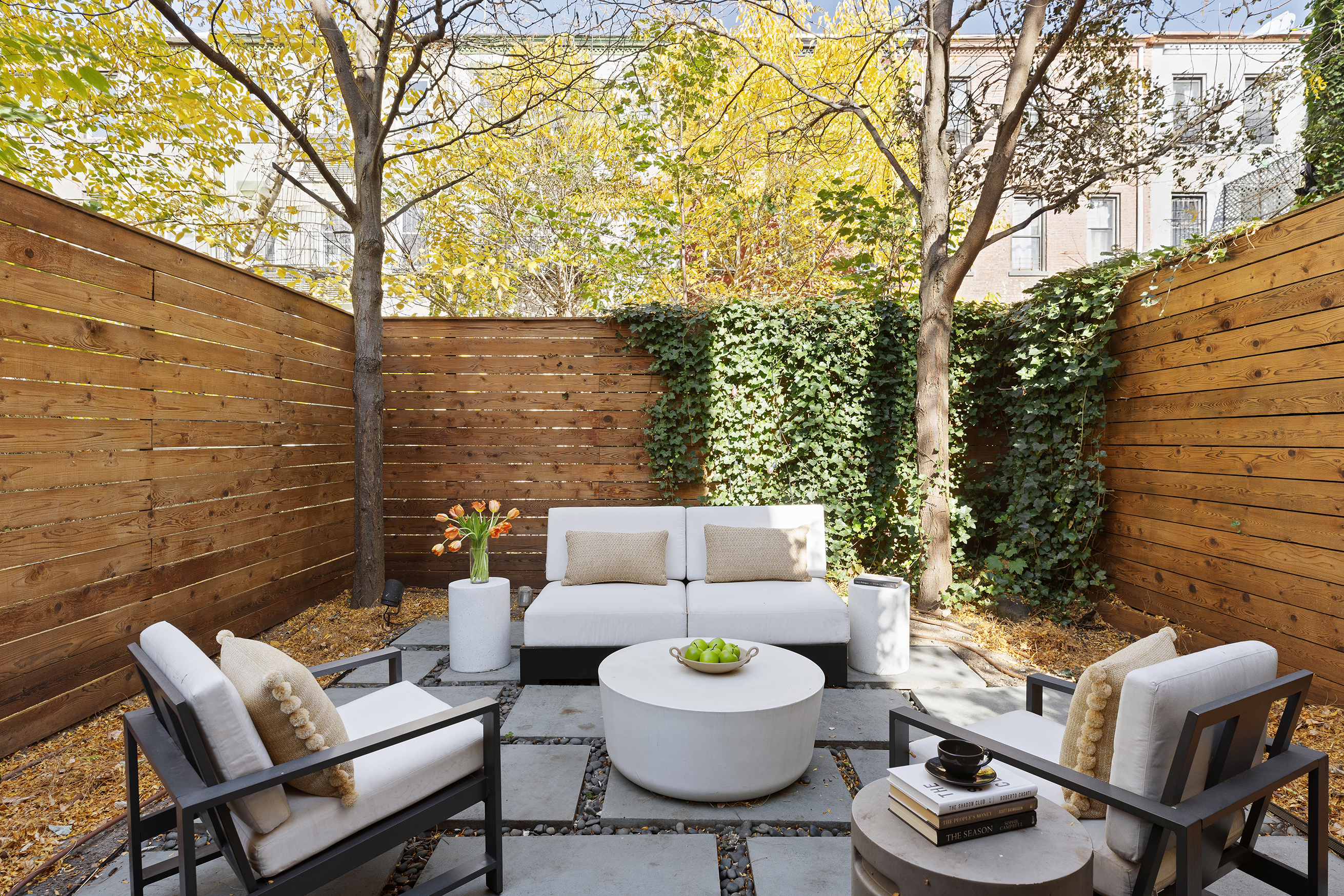 203 Halsey Street Brooklyn, NY 11216 - Photo 14 of 21 a view of a patio with couches table and chairs and potted plants