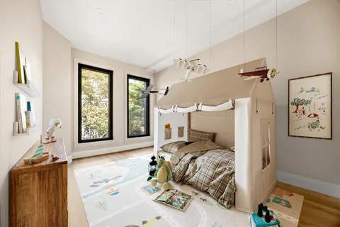 a bedroom with a bed and a couch