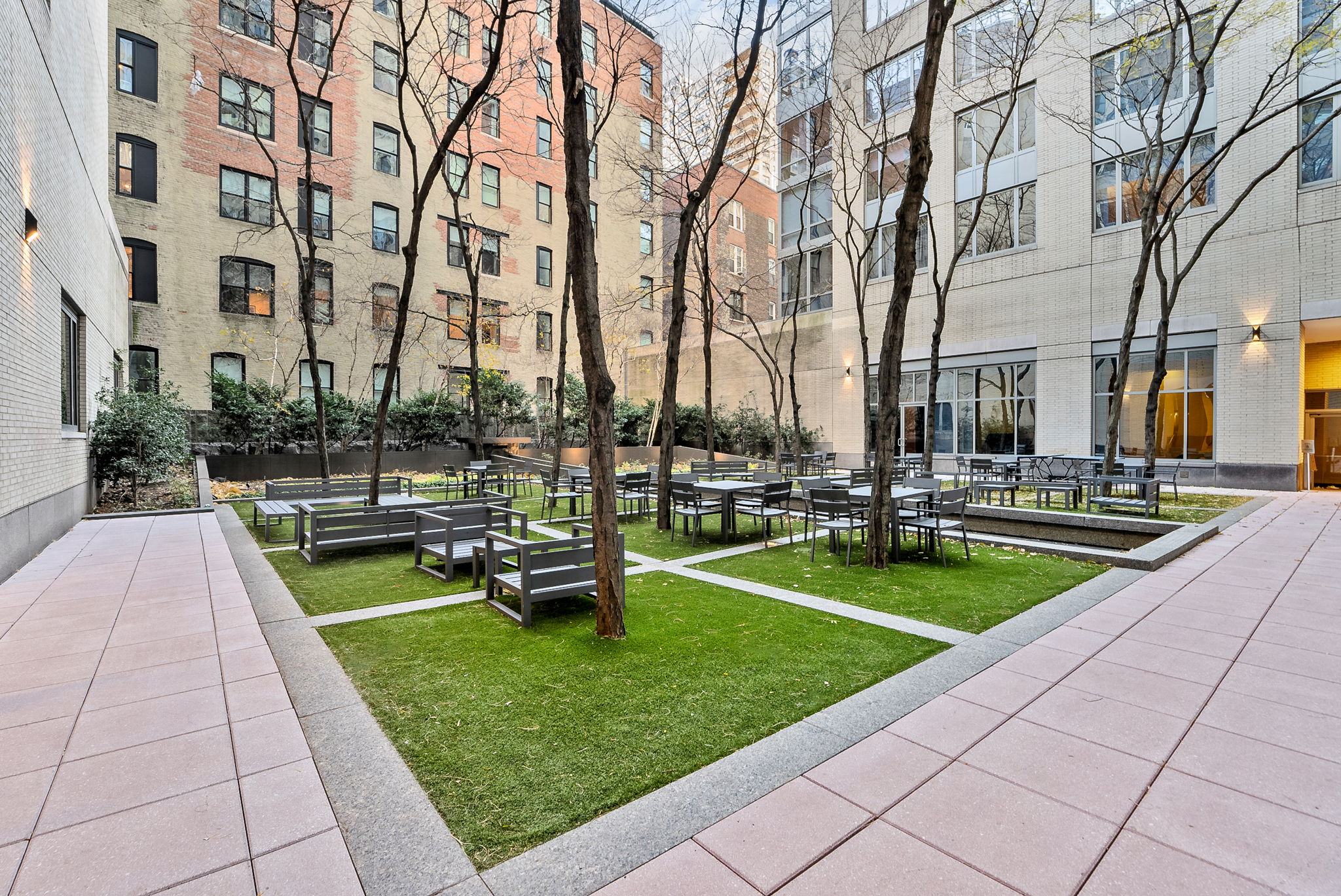 220 Riverside Boulevard, Unit 4M Manhattan, NY 10069 - Photo 10 of 11 a view of a swimming pool with a bench and trees