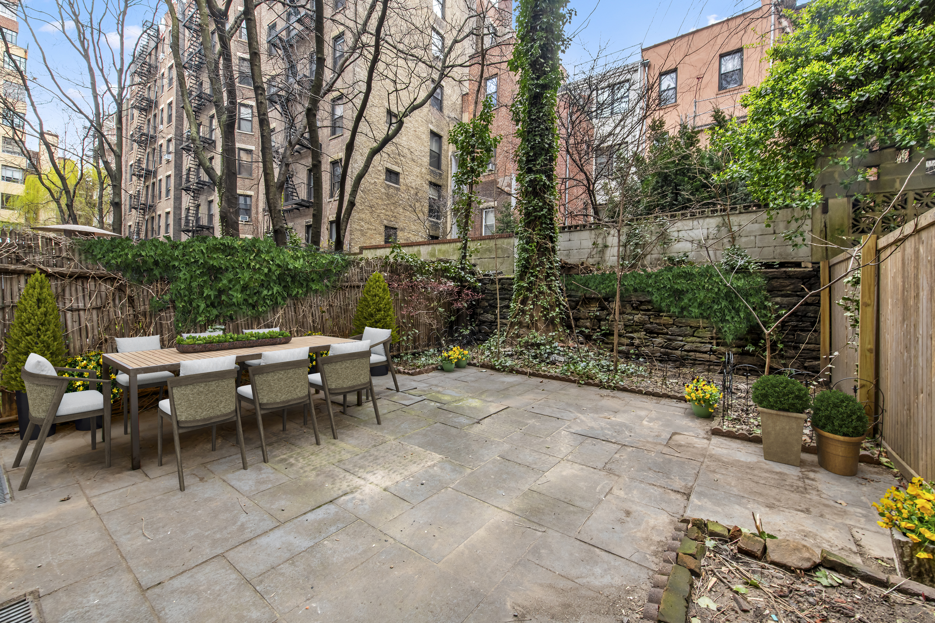 309 West 82nd Street, Unit C Manhattan, NY 10024 - Photo 1 of 12 a view of a tables and chairs in a backyard
