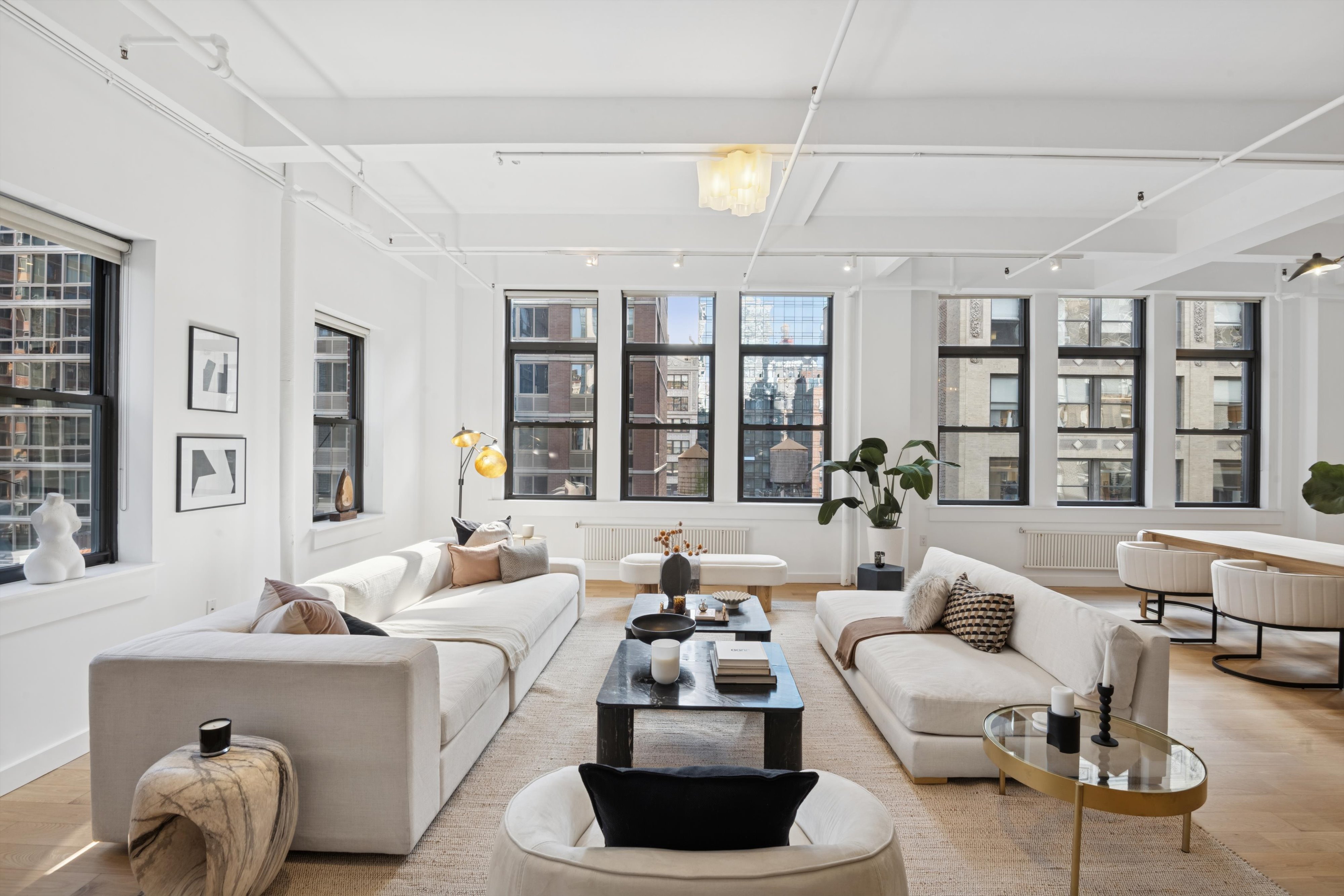 109 West 26th Street, Unit 9 Manhattan, NY 10001 - Photo 3 of 23 a living room with furniture and a large window