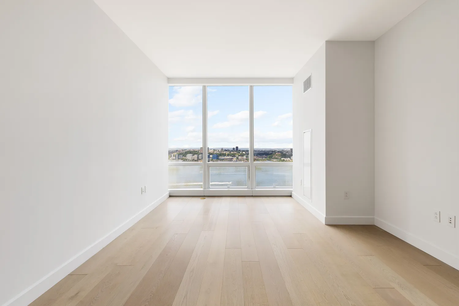 a view of an empty room and window