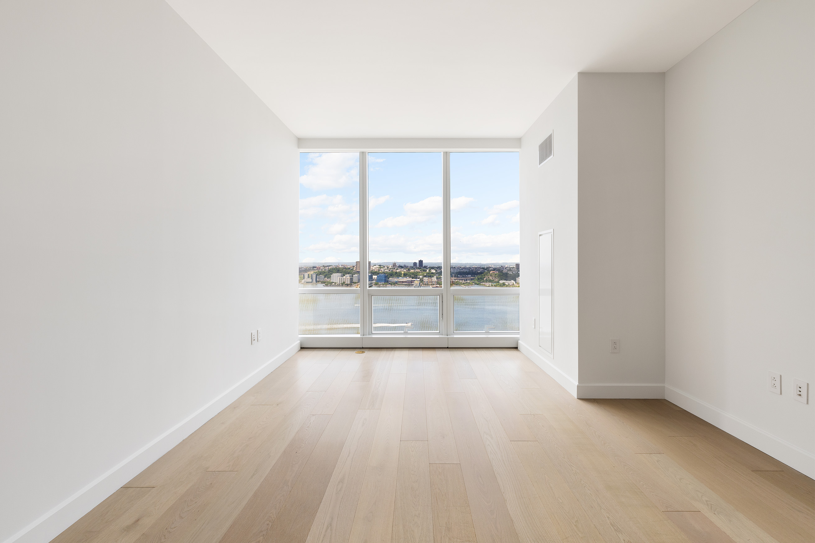 a view of an empty room and window
