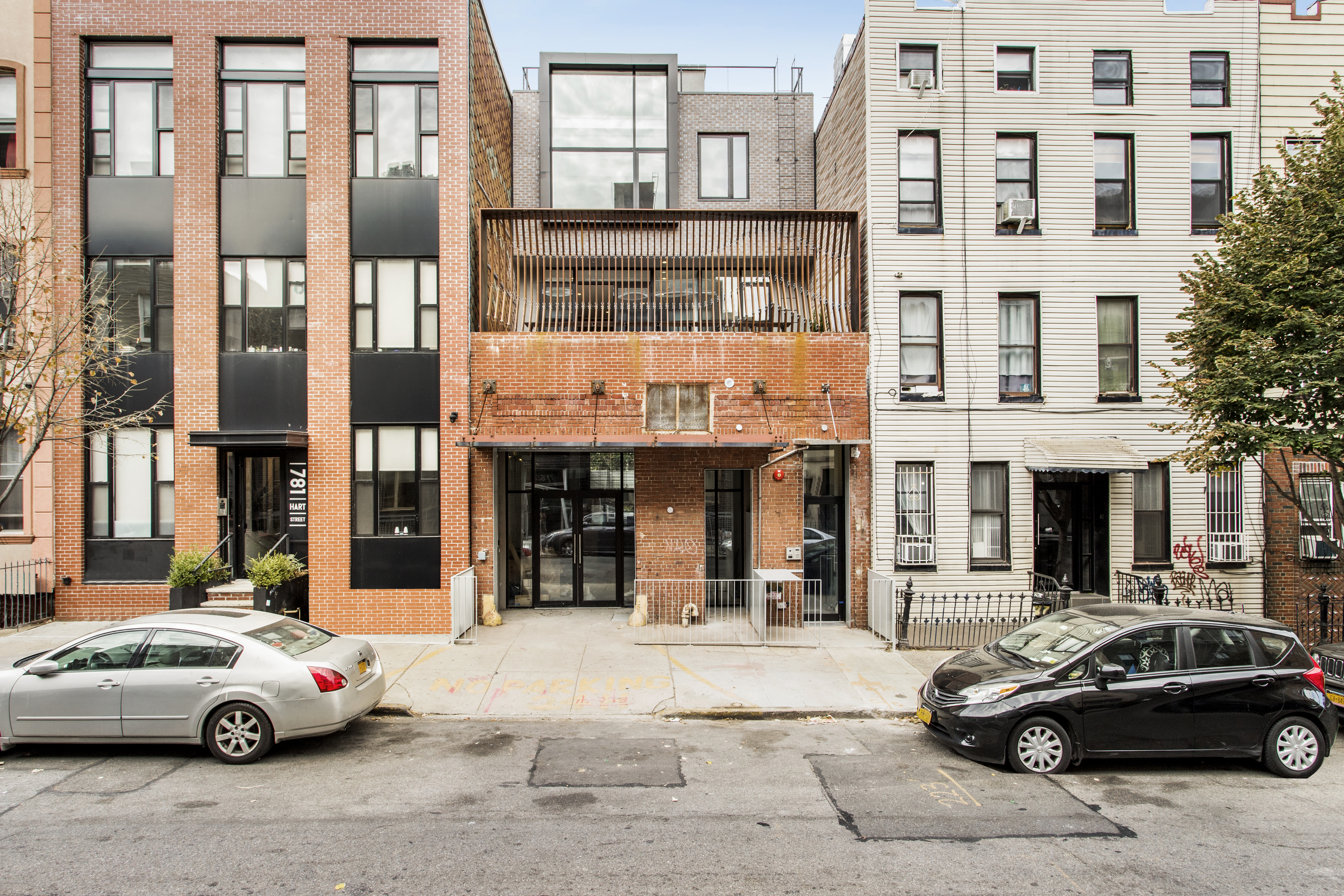 785 Hart Street, Unit THB Brooklyn, NY 11237 - Photo 6 of 15 a cars parked in front of a building
