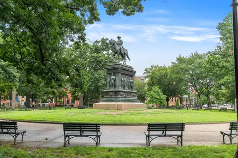 a view of street with sitting area