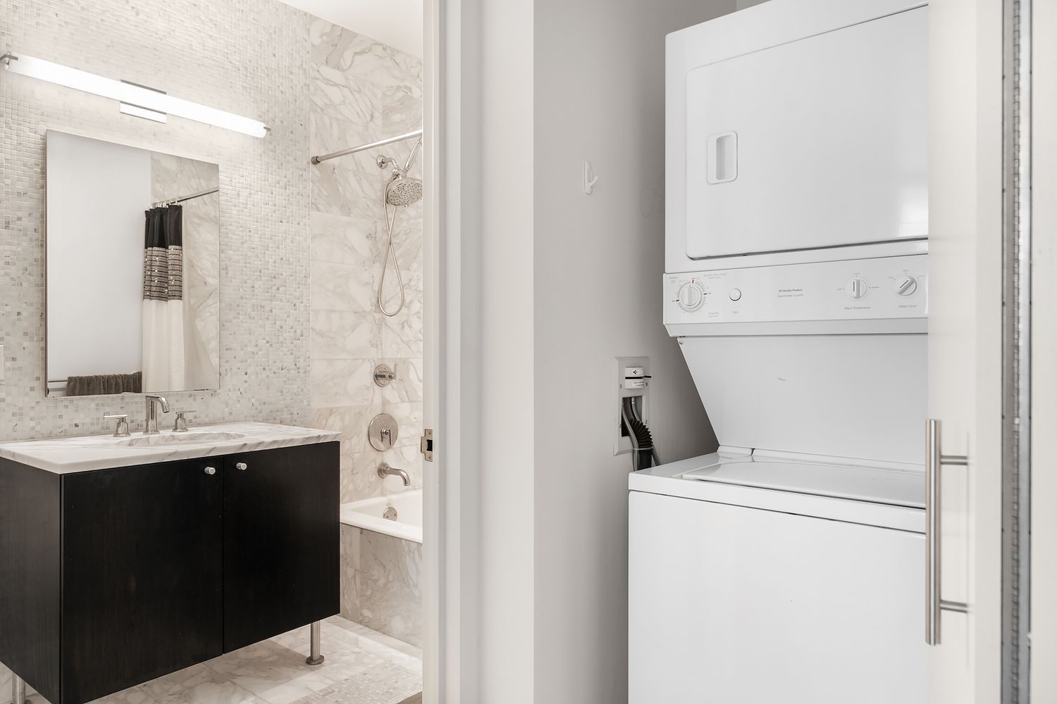 46-30 Center Boulevard, Unit 406 Queens, NY 11109 - Photo 8 of 23 a utility room with dryer and washer