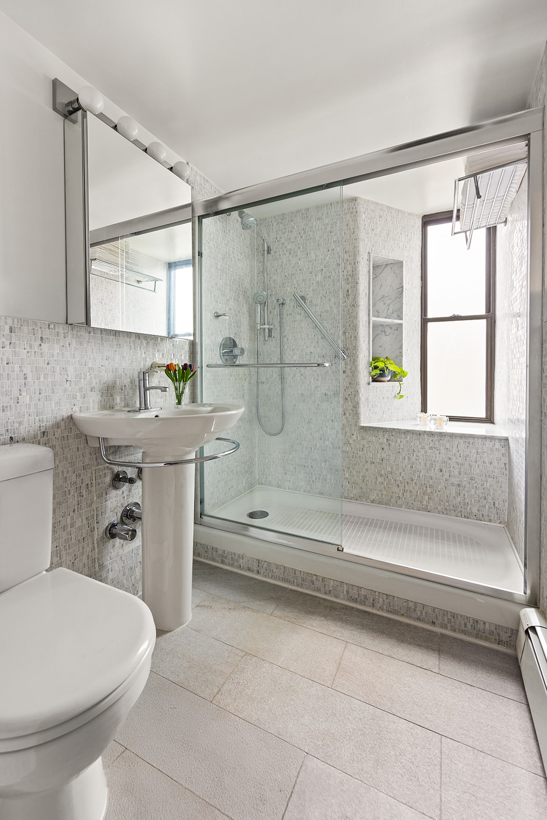 111 Hicks Street, Unit 11B Brooklyn, NY 11201 - Photo 8 of 12 a bathroom with a sink a toilet and shower