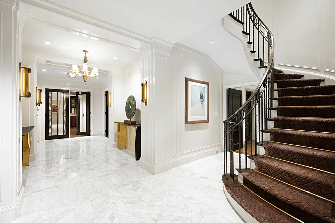 a view of a hallway view with staircase