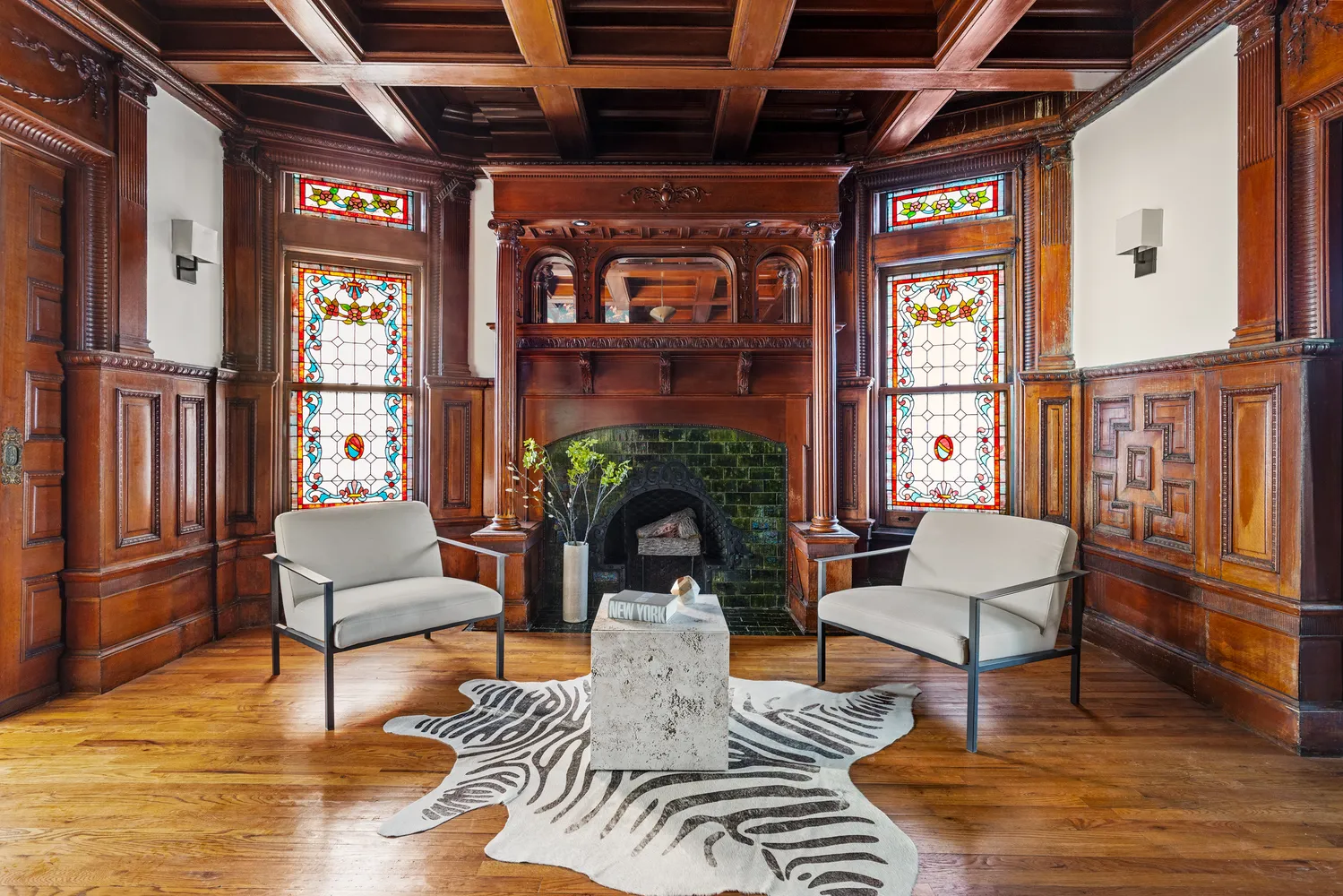 a living room with furniture a fireplace and a table