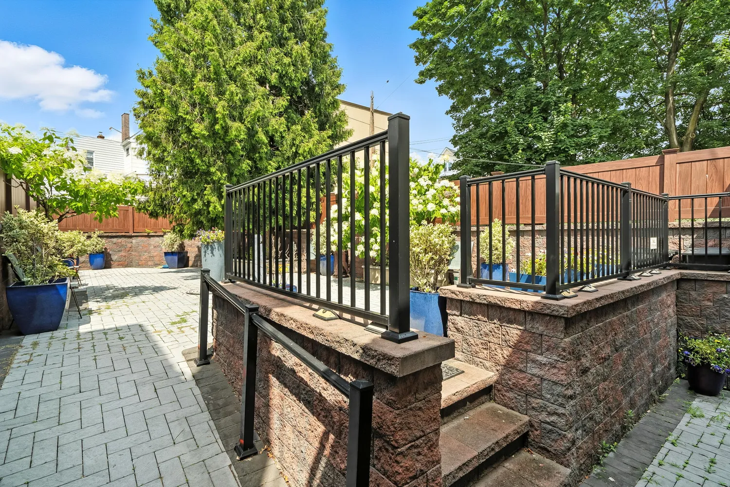 a view of a patio with a table and chairs