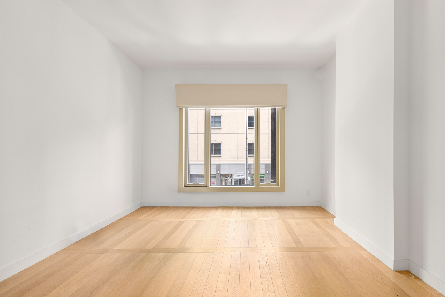 30 Warren Street, Unit 2A Manhattan, NY 10007 - Photo 5 of 10 an empty room with a window