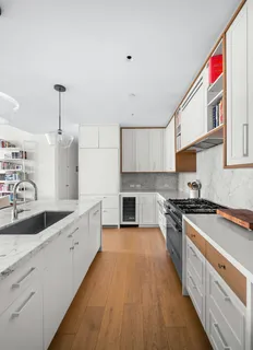 a large kitchen with a stove top oven