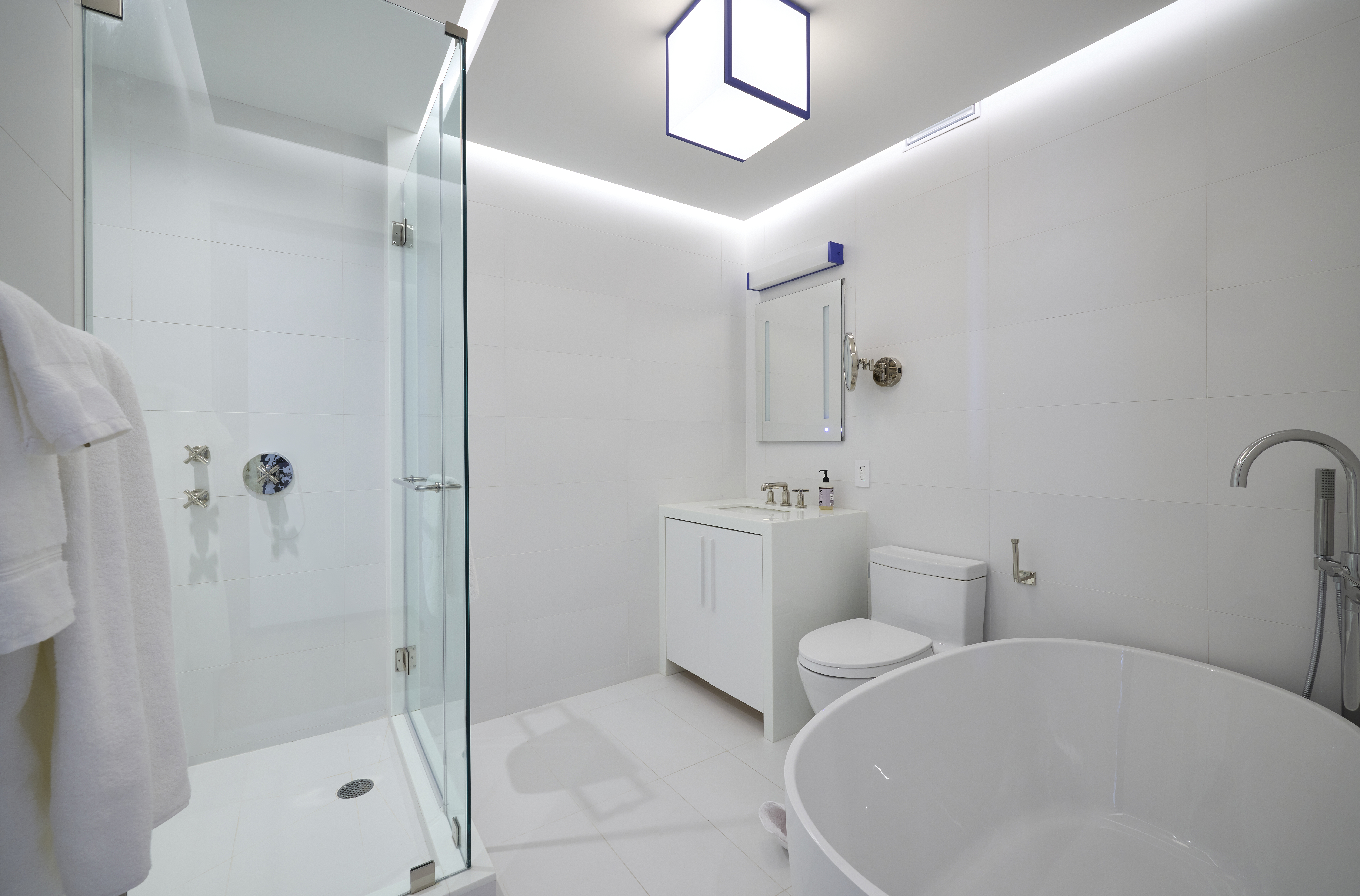 1001 5th Avenue, Unit 18A Manhattan, NY 10028 - Photo 8 of 13 a bathroom with a toilet a sink and shower