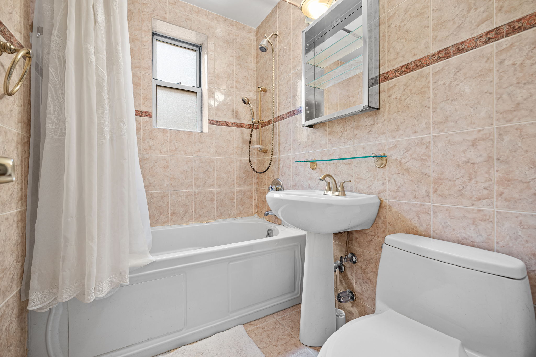 3850 Hudson Manor Terrace, Unit 1EE/2EE Bronx, NY 10463 - Photo 15 of 27 a bathroom with a sink toilet and shower